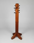 A brown wooden hall tree with a rustic design, featuring multiple hooks for hanging items, crafted using techniques that include nail and spike insertion.