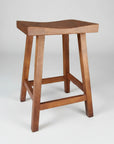 A brown wooden Shaker saddle stool with a smooth texture finish and a scooped seat design.