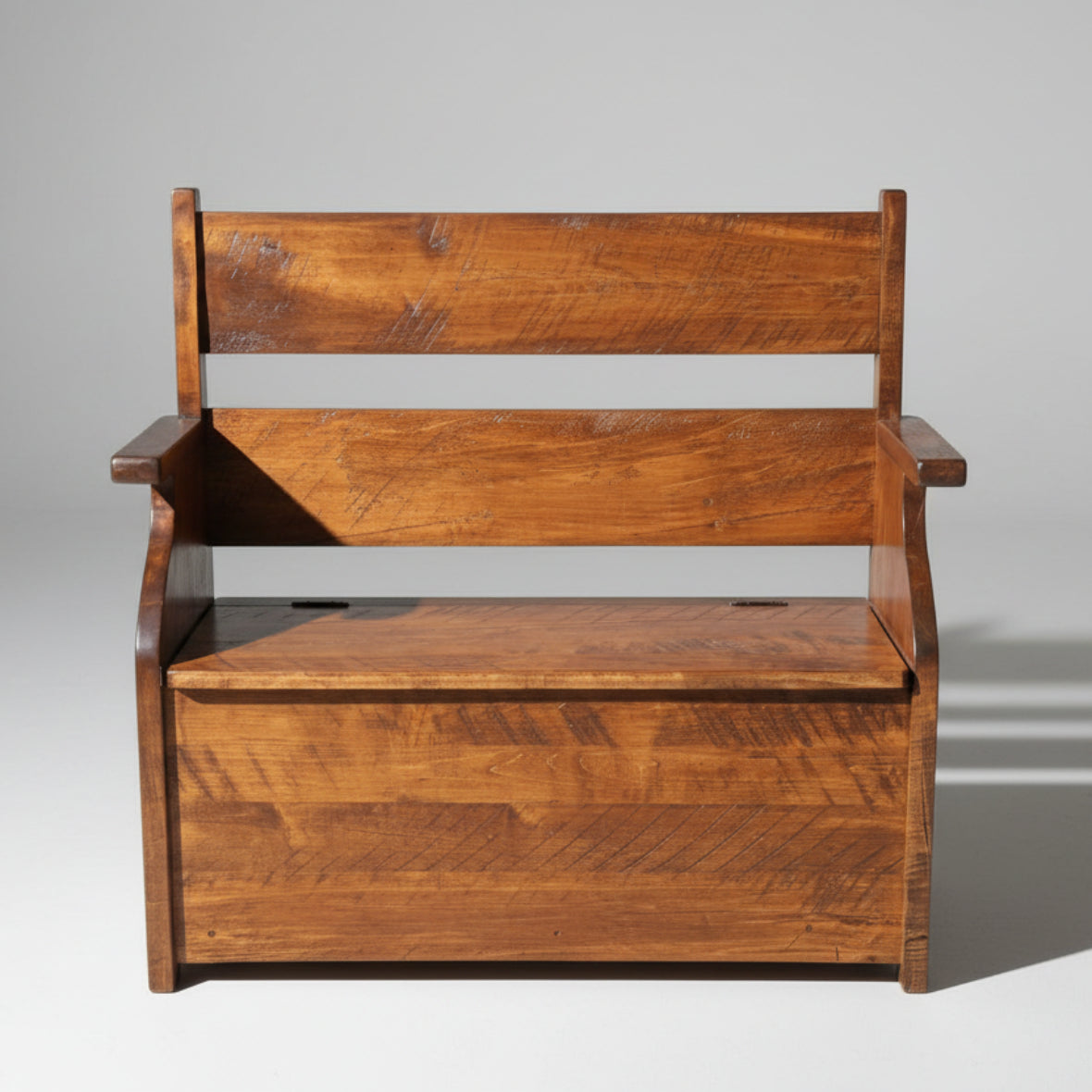 A rustic wooden deacon's bench with a lift-up seat revealing storage space, featuring a standard wood texture.