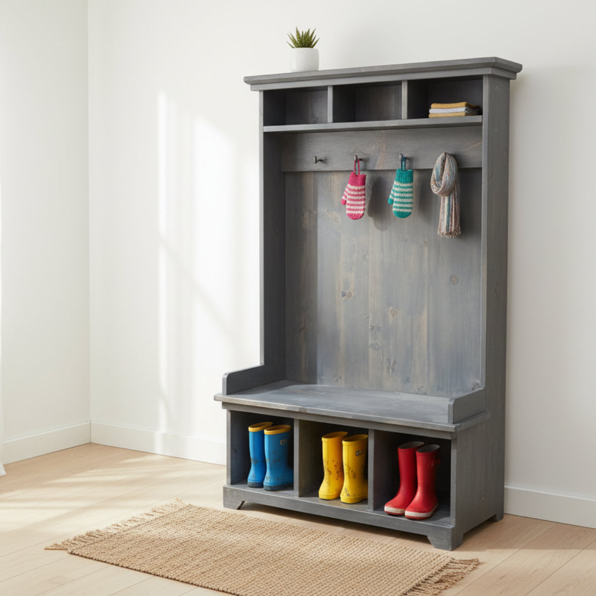 A rustic hall bench with storage cubbies and a seat, made from Canadian solid wood, with a standard wood texture.