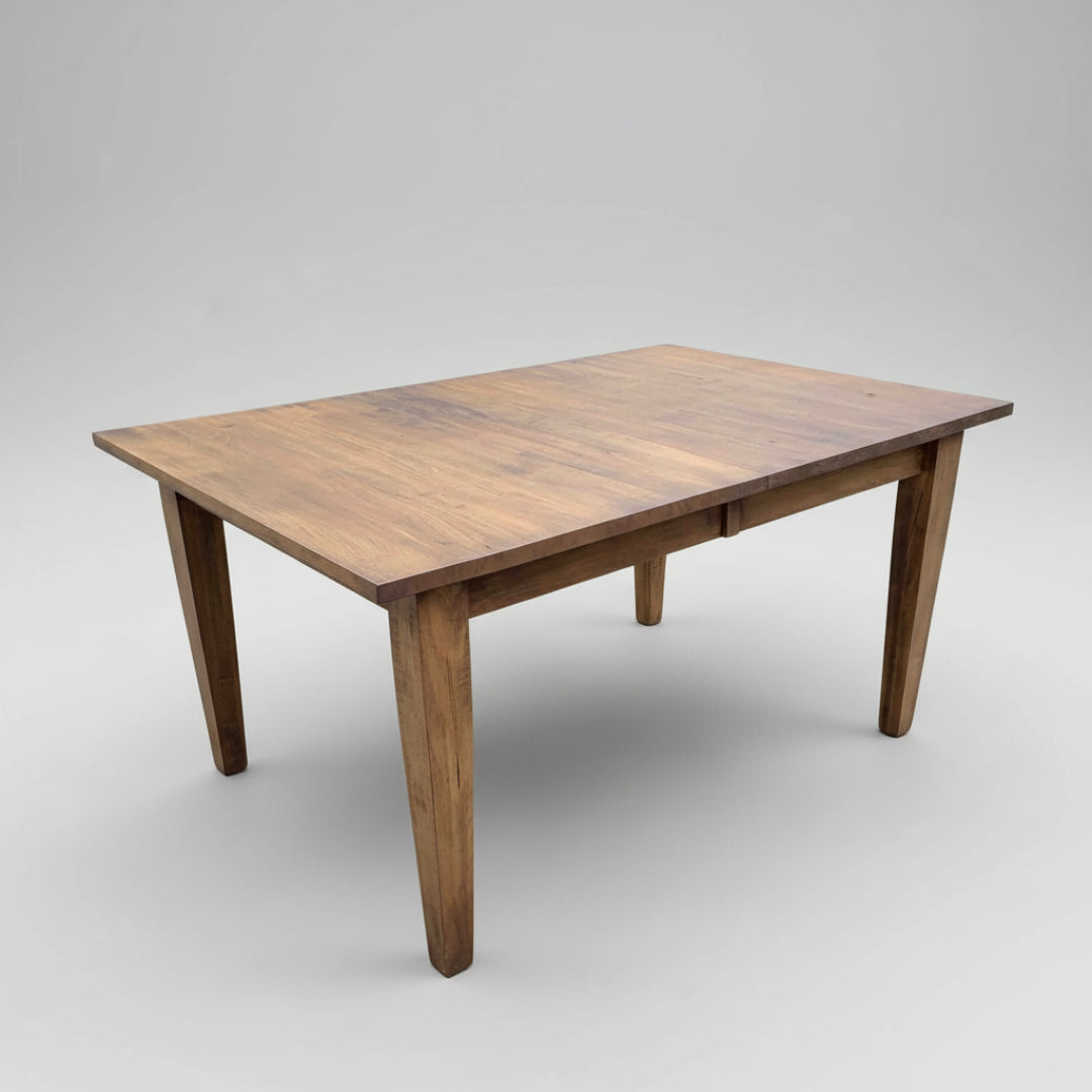 A rectangular Shaker Harvest Table with tapered legs and a smooth wood texture finish.