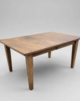 A rectangular Shaker Harvest Table with tapered legs and a smooth wood texture finish.